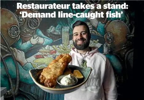  ?? JOSEPH JOHNSON/STUFF ?? Anton Mathews, owner of FUSH fish and chip shop, is refusing to sell tarakihi because of low stock and encourages customers to try other fish.