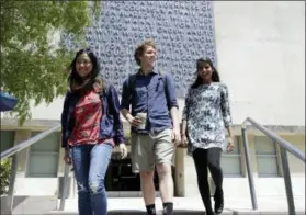  ?? MARCIO JOSE SANCHEZ—THE ASSOCIATED PRESS ?? University of California students, from left, Alice Ma,Tyler Heintz and Anjali Banerjee walk near the university’s campus Wednesday, June 6, 2018, in, Berkeley, Calif. The students, who were in Nice, France when a terrorist drove a truck down a promenade killing 83 people, including one of their classmates, have channeled their grief and anger into two nonprofits to fight terrorism.