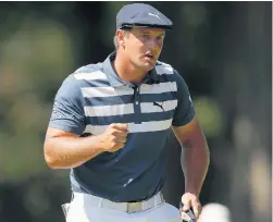  ?? CARLOS OSORIO/ASSOCIATED PRESS ?? Eventual champion Bryson DeChambeau reacts after a birdie putt on the 10th green Sunday during the final round of the Rocket Mortgage Classic at Detroit Golf Club.