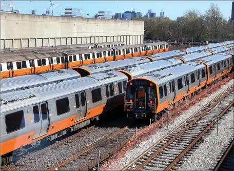  ?? NANCY LANE / HERALD STAFF FILE ?? SIDETRACKE­D: New MBTA orange line trains are seen at Wellington Station last year