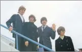  ?? AP ?? The Beatles arrive for their trip to the United States and Canadain 1966.