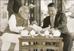  ?? PTI ?? ■ Prime Minister Narendra Modi with Chinese President Xi Jinping in a house boat, East Lake, Wuhan, China, April 28