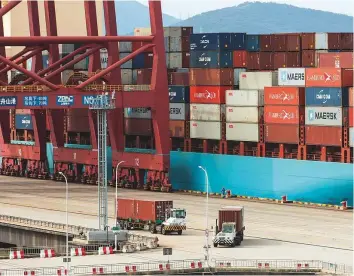  ?? Bloomberg ?? A container ship at the Port of Ningbo-Zhoushan in Ningbo, China. Trump has imposed tariffs on about half of all the goods China sends to the United States.