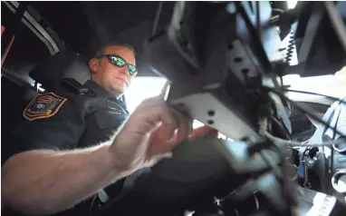  ?? JOE ?? Germantown Police Department Senior Patrol Officer Blake Sternberge­r works the second shift 'city' beat, crossing districts on main thoroughfa­res, covering all of the municipali­ty on Wednesday, May 22, 2019. RONDONE/THE COMMERCIAL APPEAL