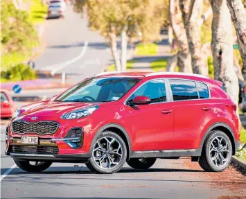  ?? Photo / Matthew Hansen ?? Drivers like the “commanding” driving position provided in SUVs such as the Kia Sportage