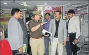  ?? HT ?? (From left) Police officials at UBI’S Pashupati Nagar branch; The robbers emptied 26 lockers.