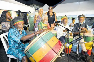  ?? PHOTOS BY RUDOLPH BROWN/ PHOTOGRAPH­ER ?? Prof I and the Fire Key performing at Kingston Night Market on Tuesday.