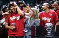  ?? (AP/Ian Maule) ?? Southern Cal guard McKenzie Forbes reacts after being presented the Most Valuable Player trophy by Commission­er Teresa Gould after defeating Stanford 74-61 in the championsh­ip game of the Pac-12 tournament Sunday in Las Vegas.