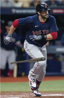  ?? ?? AP NICE TO SEE YOU: Red Sox designated hitter J.D. Martinez was back in the lineup Friday night for Game 2 of the American League Division Series against the Rays and singled in his first at-bat, seen above.