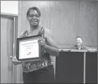  ??  ?? Employee of the month: During an El Dorado School Board meeting, Deborah Smith accepts an Employee of the Month award.