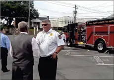  ?? / Diane Wagner ?? Rome City Commission­er Milton Slack, left, talks with Fire Chief Troy Brock Monday about the features on the department’s new, custom-designed heavy rescue pump truck.