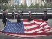  ?? ANDREW BURTON, AFP/GETTY IMAGES ?? New York first responders honor the fallen at the 9/11 memorial in Manhattan Sept. 11, 2014.