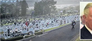  ?? Pictures: CHRIS FURLONG/GETTY, REBECCA NADEN/REUTERS ?? Dawn rises on the linked headstones of the disaster victims at Bryntaf cemetery, Aberfan. Inset: Charles yesterday