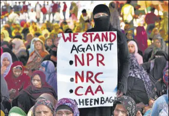  ?? BURHAAN KINU/HT PHOTO ?? A woman holds a placard during a sit-in protest against NPR, NRC and CAA at Shaheen Bagh in New Delhi on February 26.