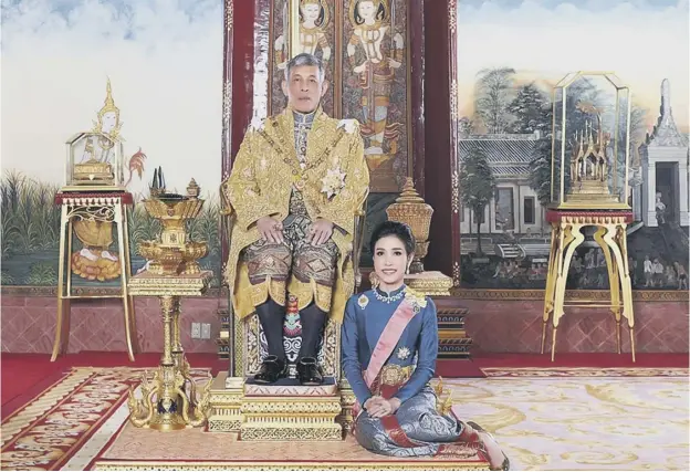  ??  ?? 0 Thailand’s King Maha Vajiralong­korn with Sineenat Bilaskalay­ani, also known as Sineenat Wongvajira­pakdi, who has been reinstated as royal noble consort
