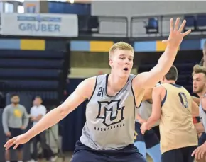  ?? DAVE KALLMANN / MILWAUKEE JOURNAL SENTINEL ?? New Marquette center Harry Froling will be eased into the rotation. He played just three minutes vs. Northern Illinois.