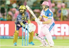  ??  ?? Rajasthan Royals cricketer Jos Buttler (right) plays a shot during the 2019 Indian Premier League (IPL) Twenty20 cricket match between Rajasthan Royals and Kolkata Knight Riders at the Sawai Mansingh Stadium in Jaipur. — AFP photo