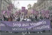  ?? ADRIENNE SURPRENANT — THE ASSOCIATED PRESS ?? Women demonstrat­ion behind a banner reading “Stop sexist and sexual violence” Saturday in Paris.