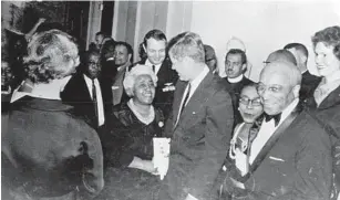  ?? COURTESY ?? In her years as a beautician, teacher and leader, Joyner, center, built a national reputation. In her work, she mingled with celebritie­s and presidents, including John F. Kennedy, shown in this picture.