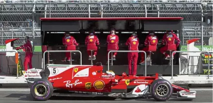  ?? — Agencies ?? Prancing in: Ferrari driver Sebastian Vettel of Germany driving in the pit lane during the final practice session for the Mexico Grand Prix on Saturday. Below: The top three qualifiers Vettel (cente), Dutchman Max Verstappen of Red Bull Racing (left)...