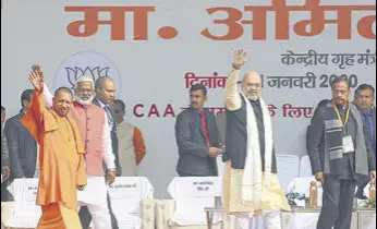  ?? AP ?? Uttar Pradesh chief minister Yogi Adityanath and Union home minister Amit Shah during a pro-caa rally in Lucknow on Tuesday.