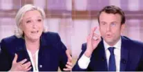  ??  ?? Le Pen and Macron gesture during the debate.