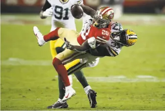  ?? Ezra Shaw / Getty Images ?? Jerick McKinnon, who had three receptions for 16 yards, is tackled by Josh Jackson.