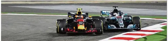  ??  ?? Too close for comfort: Red Bull’s Max Verstappen (left) makes contact with Mercedes’ Lewis Hamilton as they come round a corner during the Bahrain Grand Prix at the Sakhir circuit in Manama on Sunday.