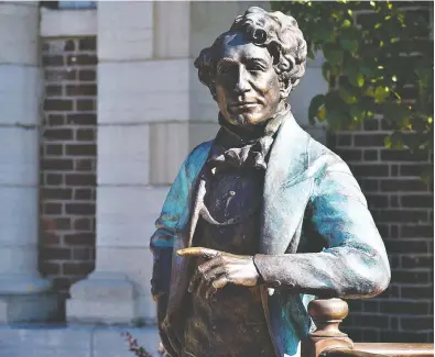  ?? DEREK BALDWIN ?? Debate continues regarding the fate of Picton downtown statue Holding Court of
Sir John A. Macdonald, the first prime minister of Canada and a dominant figure in Confederat­ion.