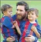  ?? AP ?? Lionel Messi with sons Mateo (L) and Thiago at Camp Nou.