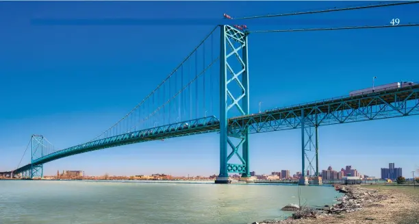  ?? IStock photo ?? The Ambassador Bridge between Windsor and Detroit, by far the busiest land crossing between Canada and the U.S., itself a symbol of the success of free trade.