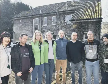  ??  ?? Staff, volunteers and ‘guests’ outside Garden House in the Cathedral Precincts