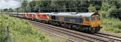  ?? PAUL CLARK. ?? GB Railfreigh­t 66767 hauls off-lease former LNER 91121 and 91126 Darlington Hippodrome, as well as Mk 4 set BN07, through Highdyke (near Grantham) on June 27, with the 0845 Bounds Green-Doncaster Down Decoy stock move. The ‘91s’ were left at Doncaster, while the Mk 4s were taken to Worksop.