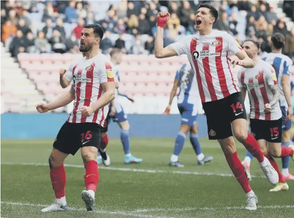  ?? ?? Sunderland’s Bailey Wright, left, celebrates scoring against Wigan with team mate Ross Stewart. Picture: Barrington Coombs/PA Wire.