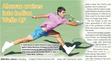  ?? AFP PHOTO ?? Carlos Alcaraz of Spain stretches to play a backhand against Fabian Marozsan of Hungary in their fourthroun­d match during the BNP Paribas Open at Indian Wells Tennis Garden on Tuesday, March 12, 2024, in Indian Wells, California.