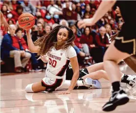  ?? Jim Gensheimer/Associated Press ?? Stanford guard Haley Jones, who had 11 points and a season-high 18 rebounds, passes against Colorado during the first quarter of the Cardinal’s 62-49 win.