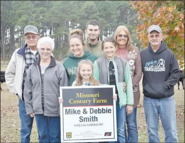  ?? RACHEL DICKERSON/ MCDONALD COUNTY PRESS ?? The Rose farm in Southwest City was recently designated a century farm by the University of Missouri Extension. Pictured are Tinley Pinc (front row), Joyce Rose (middle row, left), Latasha Pinc, Remington Pinc, Bob Rose (back row), Mike Pinc, Debbie Smith and Mike Smith.