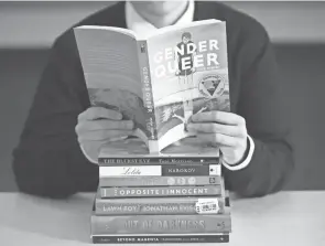  ?? RICK BOWMER/AP ?? Books with characters and plot lines involving LGBT and minority students have been the subject of complaints from parents in recent weeks.