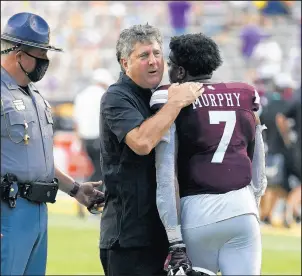  ?? GERALD HERBERT/AP ?? Coach Mike Leach was a big winner Saturday in his debut for Mississipp­i St.