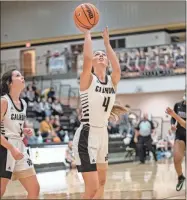  ?? Tim Godbee ?? Maggie McBrayer puts up an early two points against Hiram Friday evening at Calhoun. The Lady Jackets lost to their region 5A opponent 40-24.