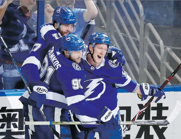  ?? MIKE CARLSON/GETTY IMAGES ?? Victor Hedman, rear, and Steven Stamkos (seen with Ondrej Palat) have been chasing a Stanley Cup for almost a decade with the Tampa Bay Lightning.