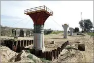  ??  ?? In this 2016 file photo, the supports for a 1,600-foot-viaduct to carry high-speed rail trains across the Fresno River are seen under constructi­on near Madera.