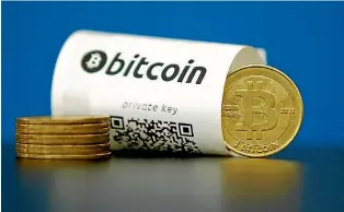  ?? PHOTO: REUTERS ?? Bitcoin outperform­ed all currencies in 2016.