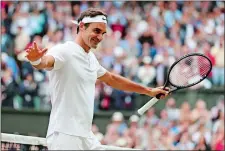  ?? GARETH FULLER/POOL PHOTO VIA AP ?? Roger Federer celebrates after beating Tomas Berdych in straight sets Friday to reach the men’s singles final at the Wimbledon Championsh­ips in London.