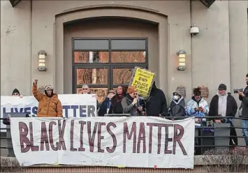  ?? Photos by H. Rose Schneider / Times Union ?? Activists protest Saturday outside Troy City Hall in response to footage of the beating of Tyre Nichols in Memphis, Tenn.