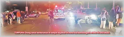  ??  ?? TUMPUAN: Orang ramai berkerumun di tempat kejadian di mana dua kemalangan berlaku di satu lokasi.