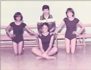  ??  ?? With her school’s gymnastics team.