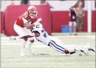  ?? Justin Casterline / Getty Images ?? UConn’s Omar Fortt tackles Indiana’s Ty Fryfogle during a 2019 game.