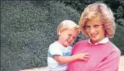  ?? AFP ?? A file picture of Princess Diana holding Prince William while pregnant with Prince Harry at an undisclose­d location.