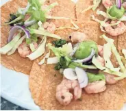  ?? ASHLEIGH SPITZA ?? Shrimp tacos need only a simple marinade and a few more ingredient­s.